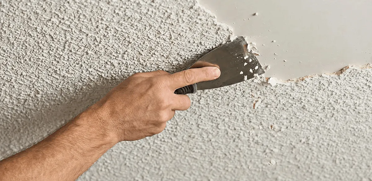 Popcorn ceiling removal scraping off textured ceiling finish in Boston, MA