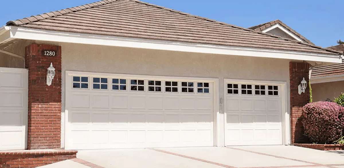 Residential garage door repair service for a double garage door in Boston, MA
