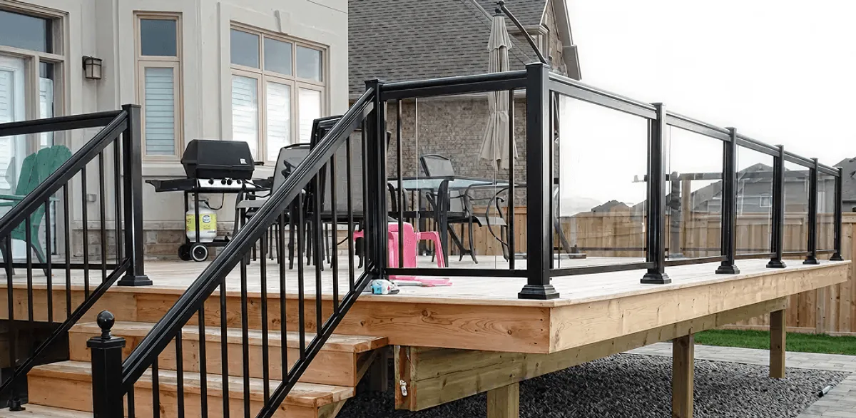 Handrail installation on a deck staircase for safety and code compliance in Boston, MA